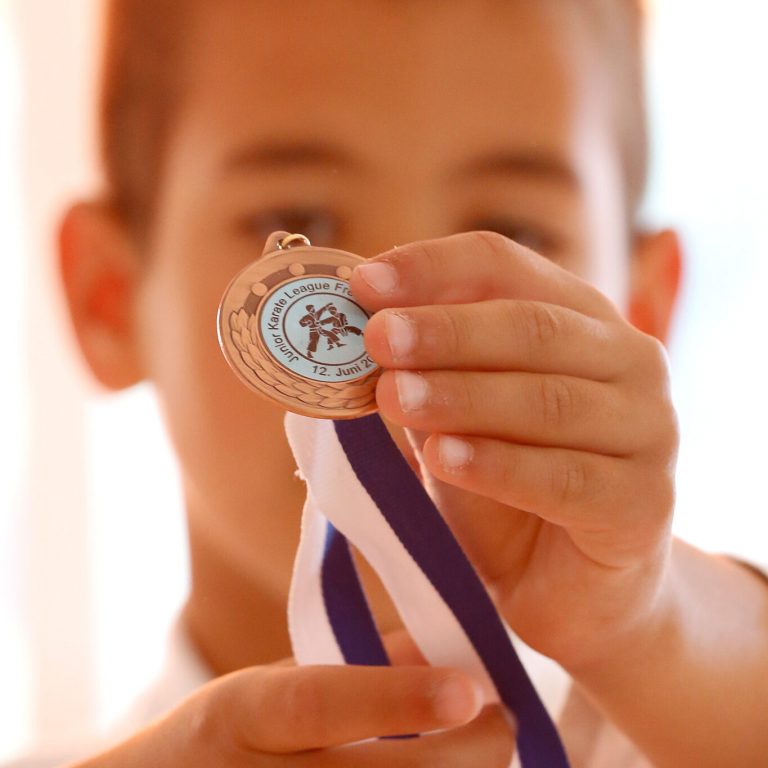 Colin McGuinness at the Junior Karate League in Frenkendorf 2022 Colin McGuinness showing his bronze medal at the Junior Karate League in Frenkendorf 2022